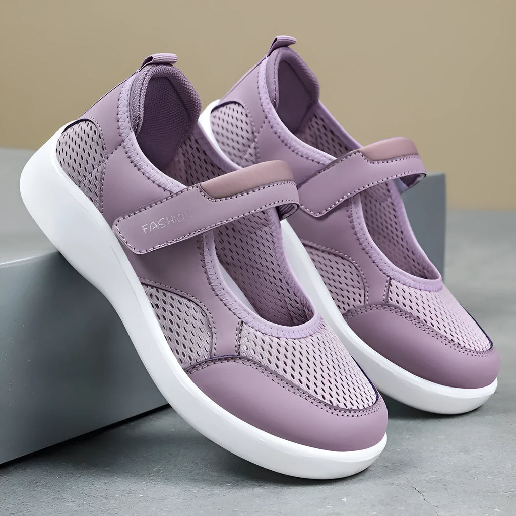 Women's low-top casual sneaker in grey mesh with velcro strap and flat polyurethane sole.