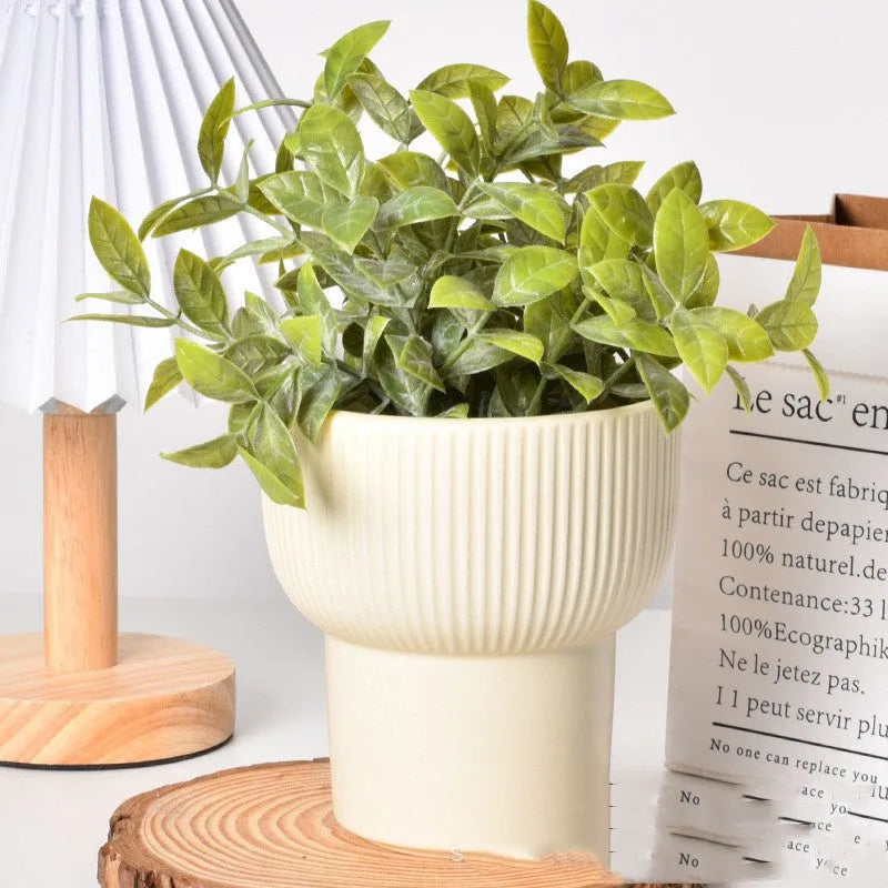 Roman column matte yellow ceramic flower pot with breathable, self-absorbent design.