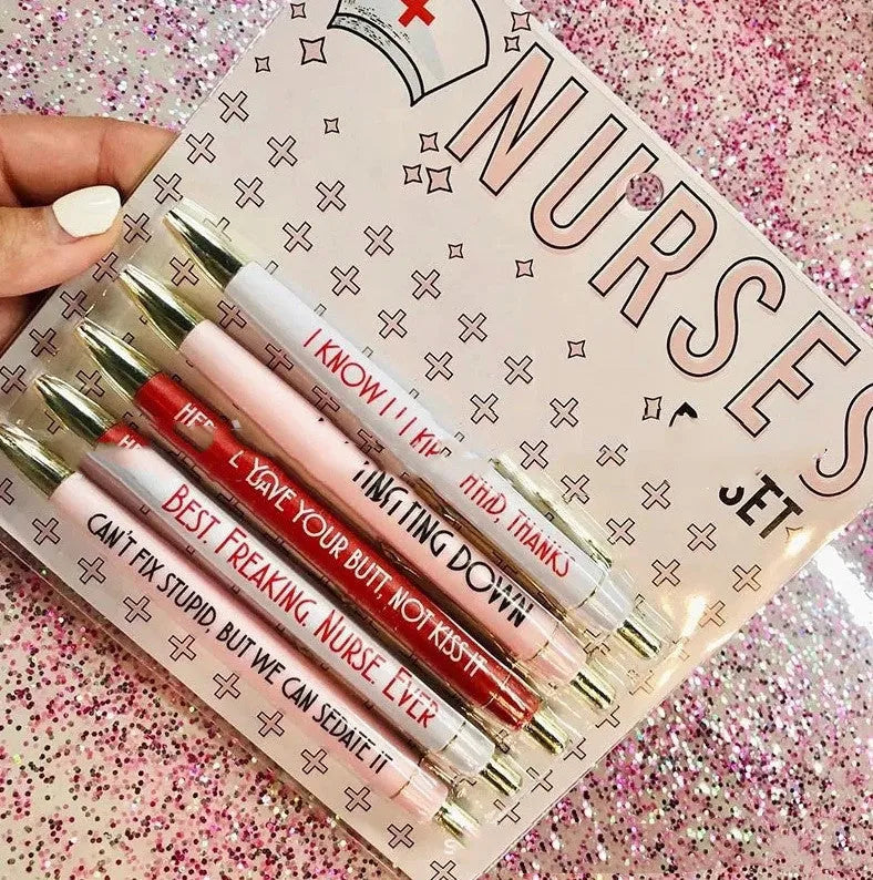 Five nurse-themed retractable ballpoint pens with medical motif designs arranged together
