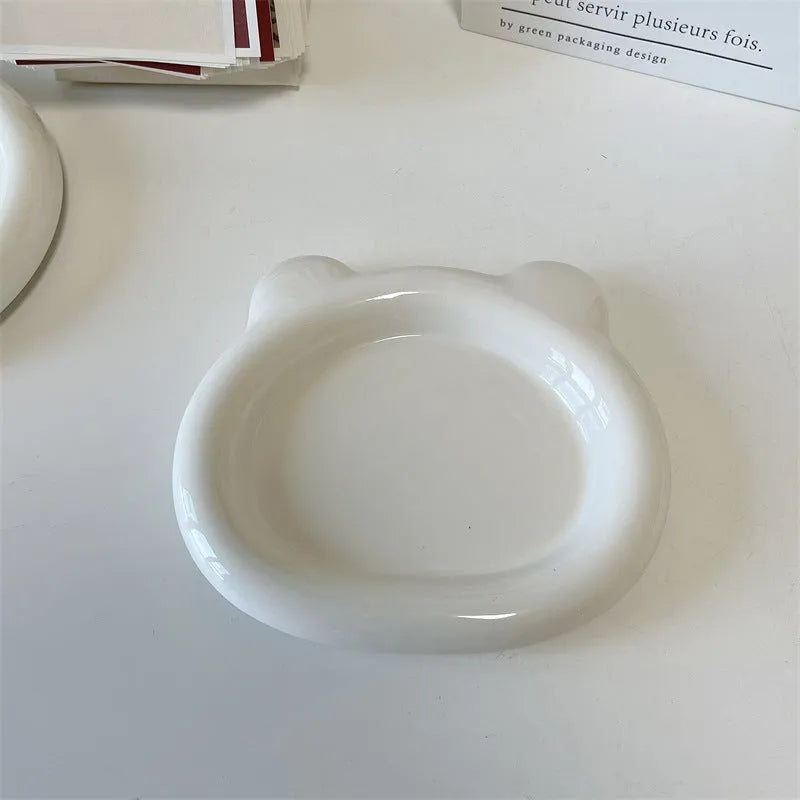 White ceramic plate with chubby toot bear illustration, porcelain potted tray.