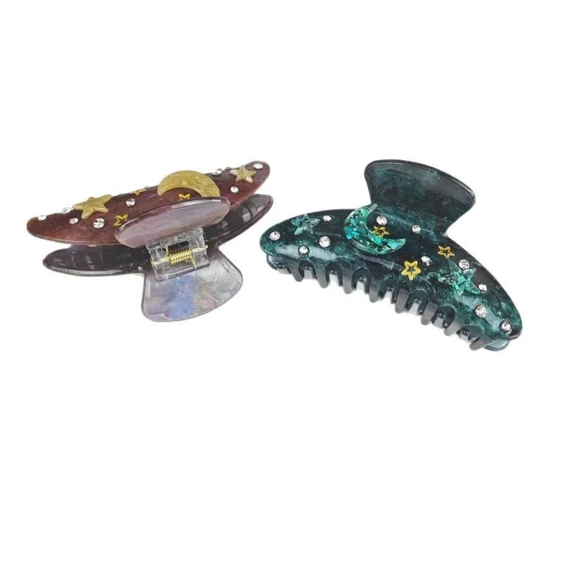 Oversized starry sky pattern hair barrette in cellulose acetate, shown in a choice of colours.
