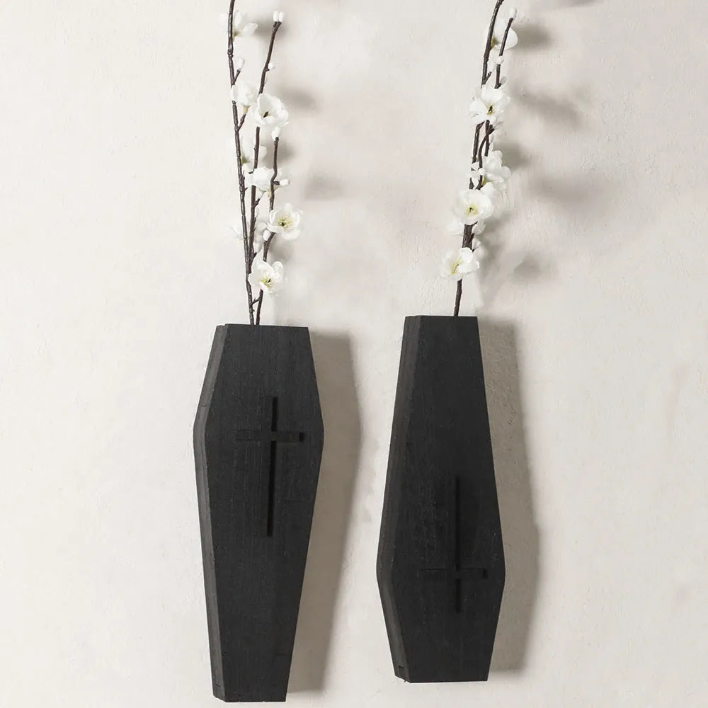 Black wooden cross wall shelf decoration with display ledge measuring 27 by 9 centimetres