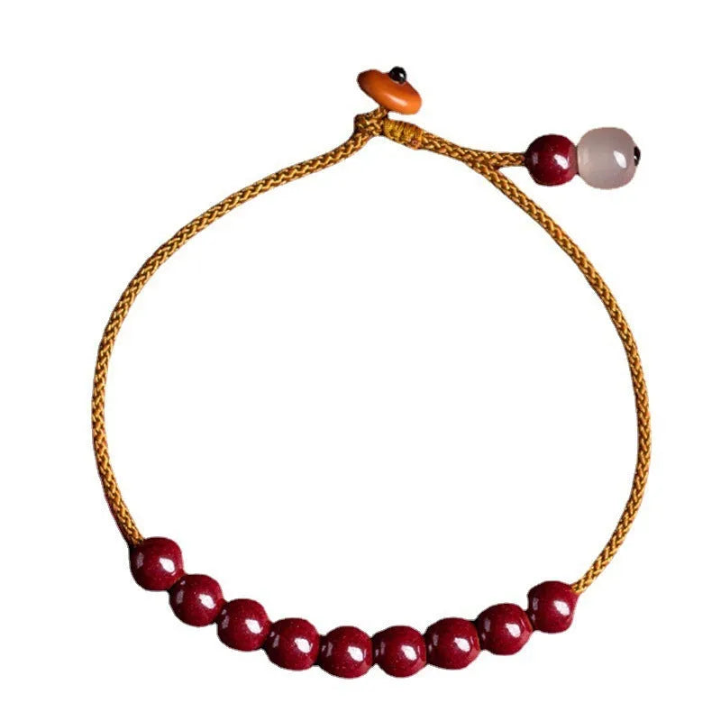 Hand-woven geometric bracelet made from raw red cinnabar ore on an adjustable cord.