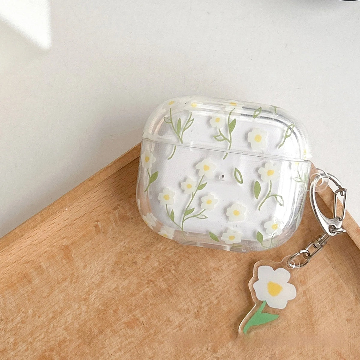 White floral pattern TPU protective cover for Apple AirPods charging case showing high transparency