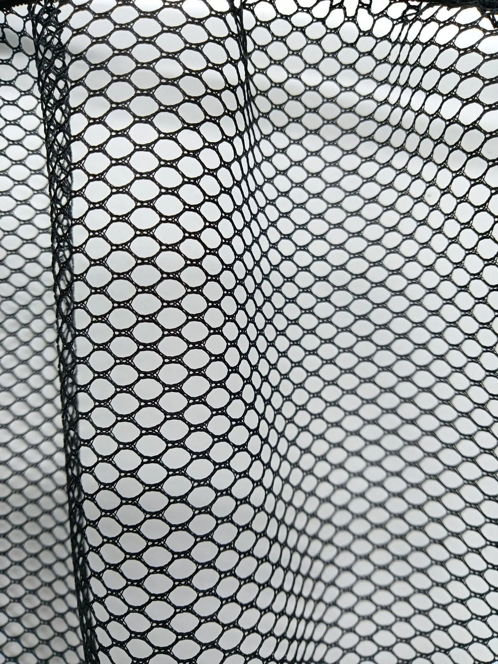 Elastic polyester mesh car boot storage net shown in a vehicle trunk.