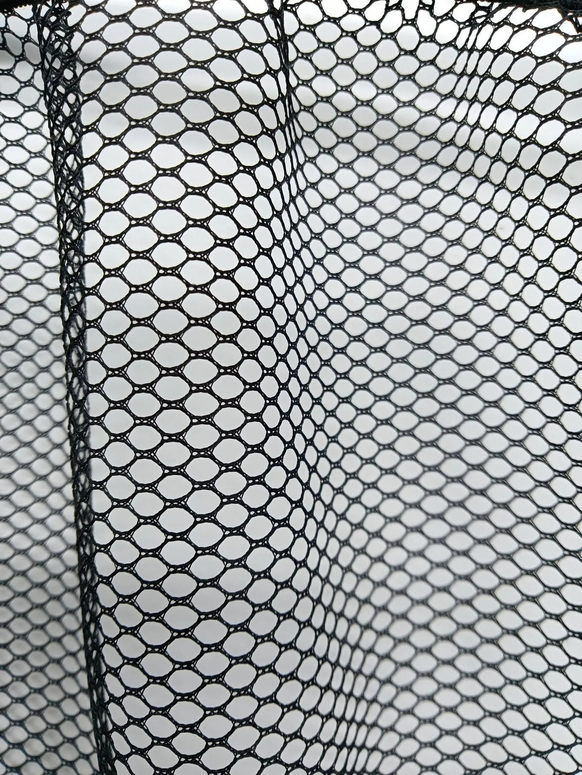 Elastic polyester mesh car boot storage net shown in a vehicle trunk.