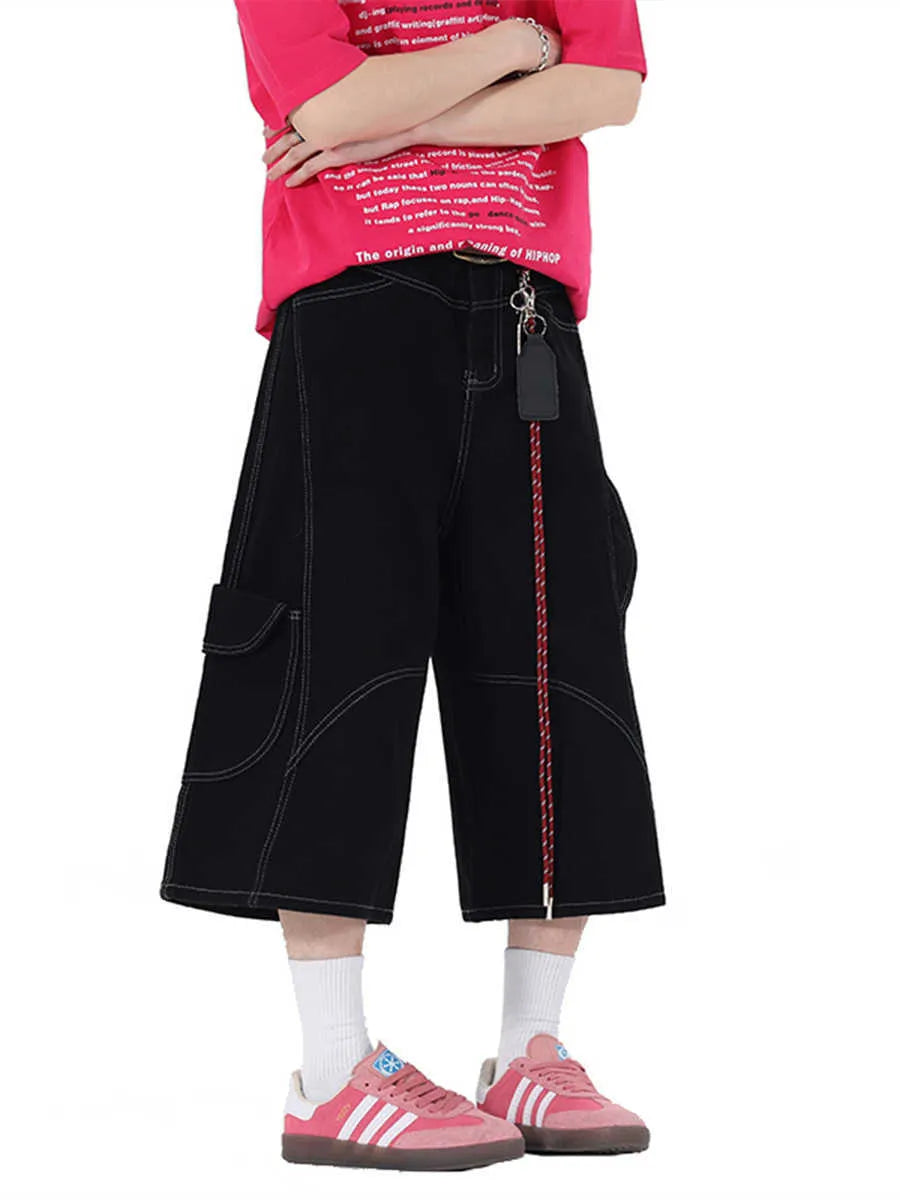 Retro denim workwear shorts with multiple pockets and wide leg cropped design in black colour