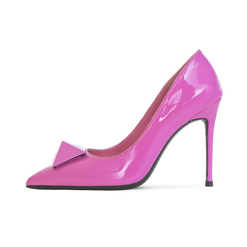 Pink patent leather women's stiletto high heels with pointed toe and metal rivet buckle detail.