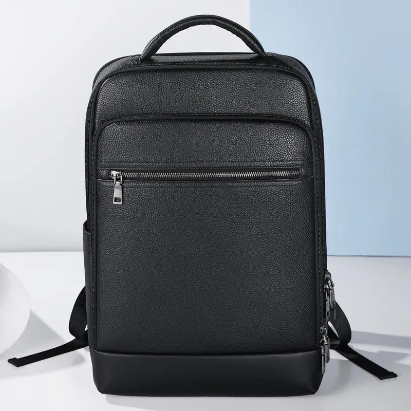 Black leather men's business backpack with curved shoulder straps and visible sewing lines