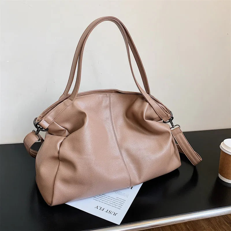 Large soft-surface PU leather messenger tote bag with long crossbody strap, shown in black colour