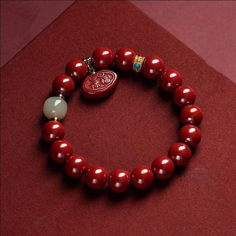 Natural red cinnabar bracelet with Ping An Fu Lu symbol carved in emperor sandstone style.