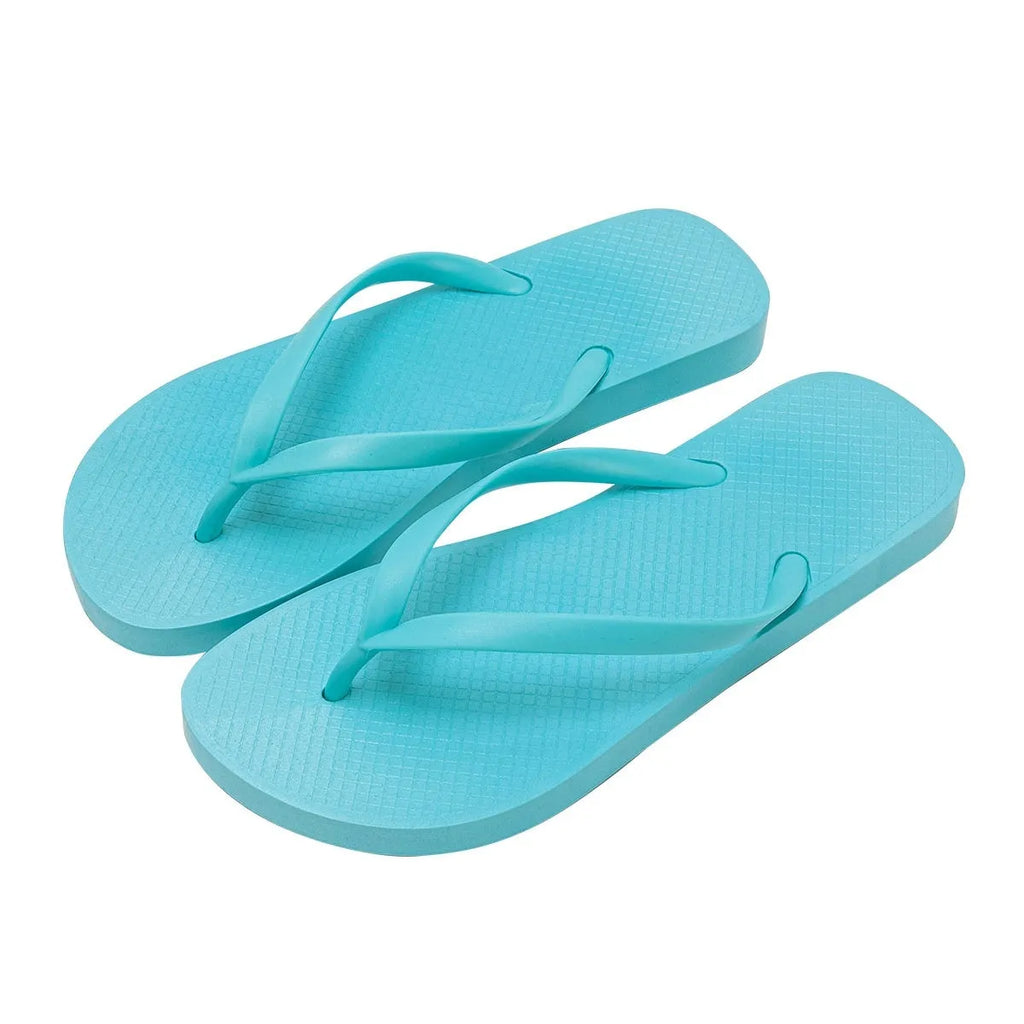 Orange foldable beach slippers with non-slip soles shown next to a pair in purple and black.