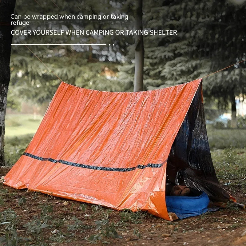 Orange four-season disaster relief tent kit with sleeping bag and raincoat for emergency outdoor shelter