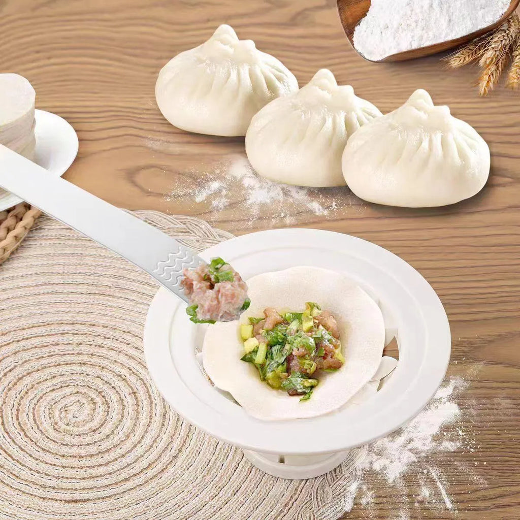 Black Jinkali set of four plastic steamed bun moulds for shaping dumplings and baozi on a kitchen worktop.