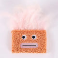 Colourful catnip plush toy with big mouth explosion head shape in blue, green, orange, and purple options