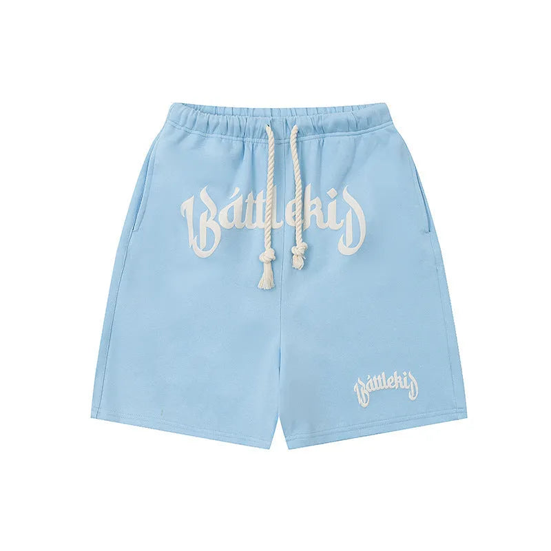Loose grey cotton-blend streetwear shorts with a cropped sweatpants silhouette on a neutral background.