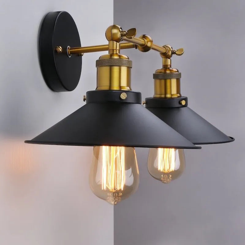 Black iron industrial-style wall lamp with two adjustable heads in a retro design