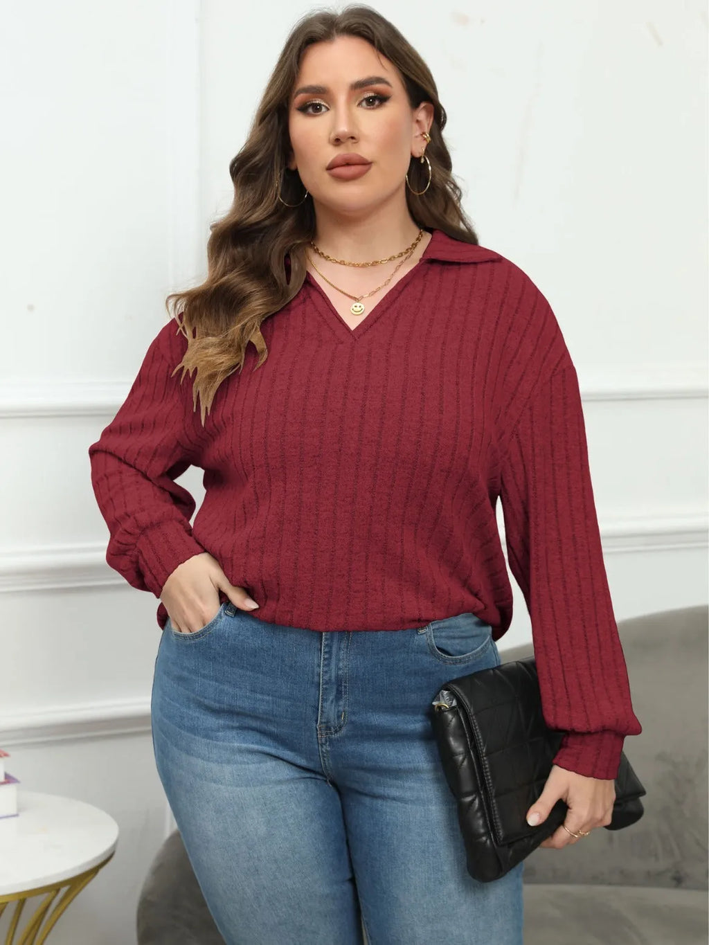 Women's plus size gray polo collar fleece shirt with lantern sleeves on a hanger.