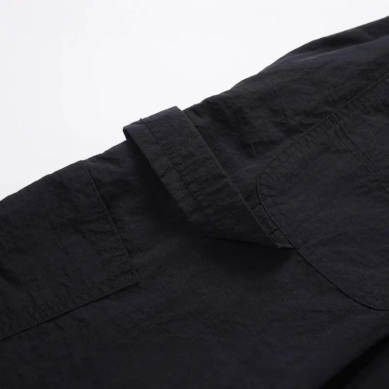 Black baggy paratrooper trousers with elastic drawstring waist and three-dimensional cutting