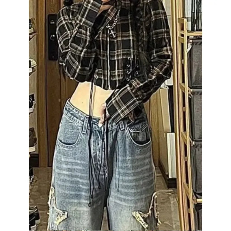 Blue high-waist women's wide-leg jeans made from cotton denim fabric on a neutral background.