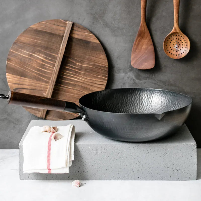 Traditional black iron wok with wooden handle, 40cm diameter.