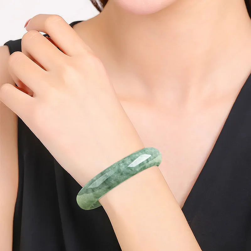 Natural dark pea green jade beaded bracelet for women, shown with gift box.