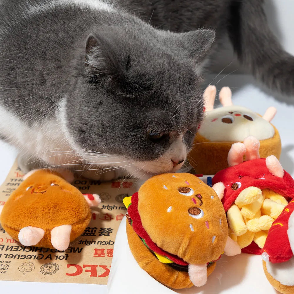 Set of soft cat chewing toys shaped like a chicken leg, hamburger, fries, hot dogs, and bread.