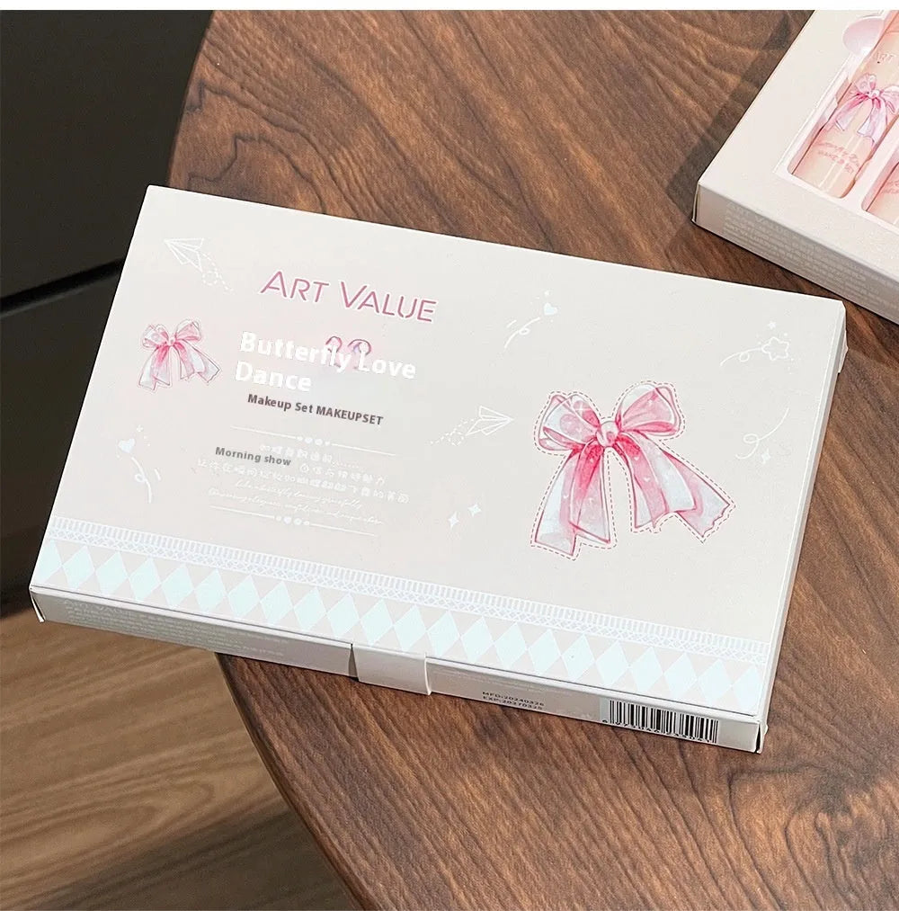 Butterfly coloured makeup box with four pink lip mud containers, blush compact, and necklace