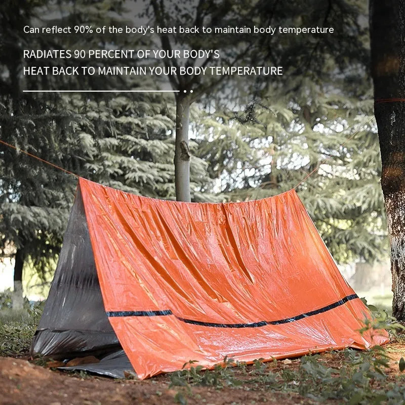 Orange four-season disaster relief tent kit with sleeping bag and raincoat for emergency outdoor shelter