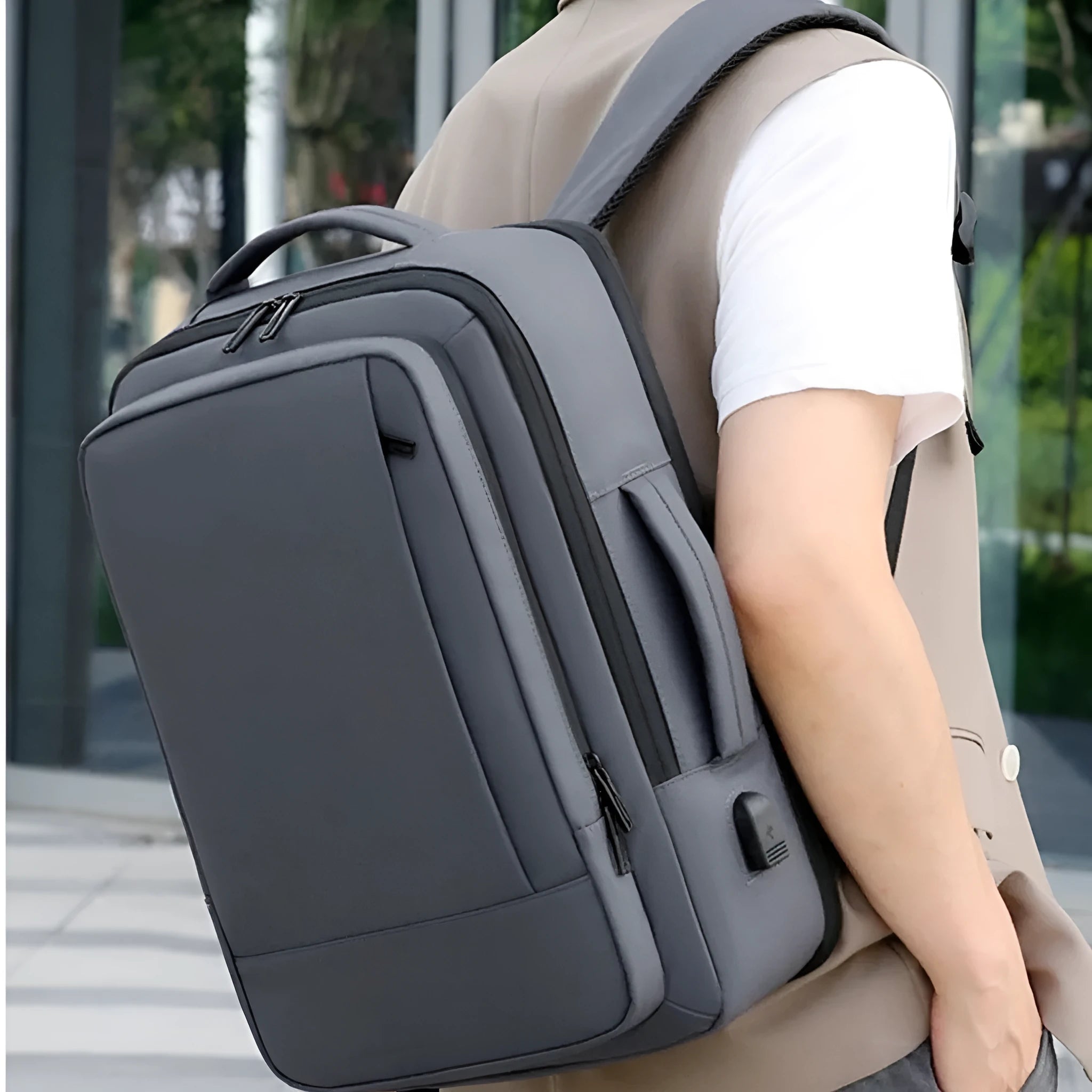 Black waterproof Oxford cloth backpack with curved shoulder strap showing 20-35 litre capacity