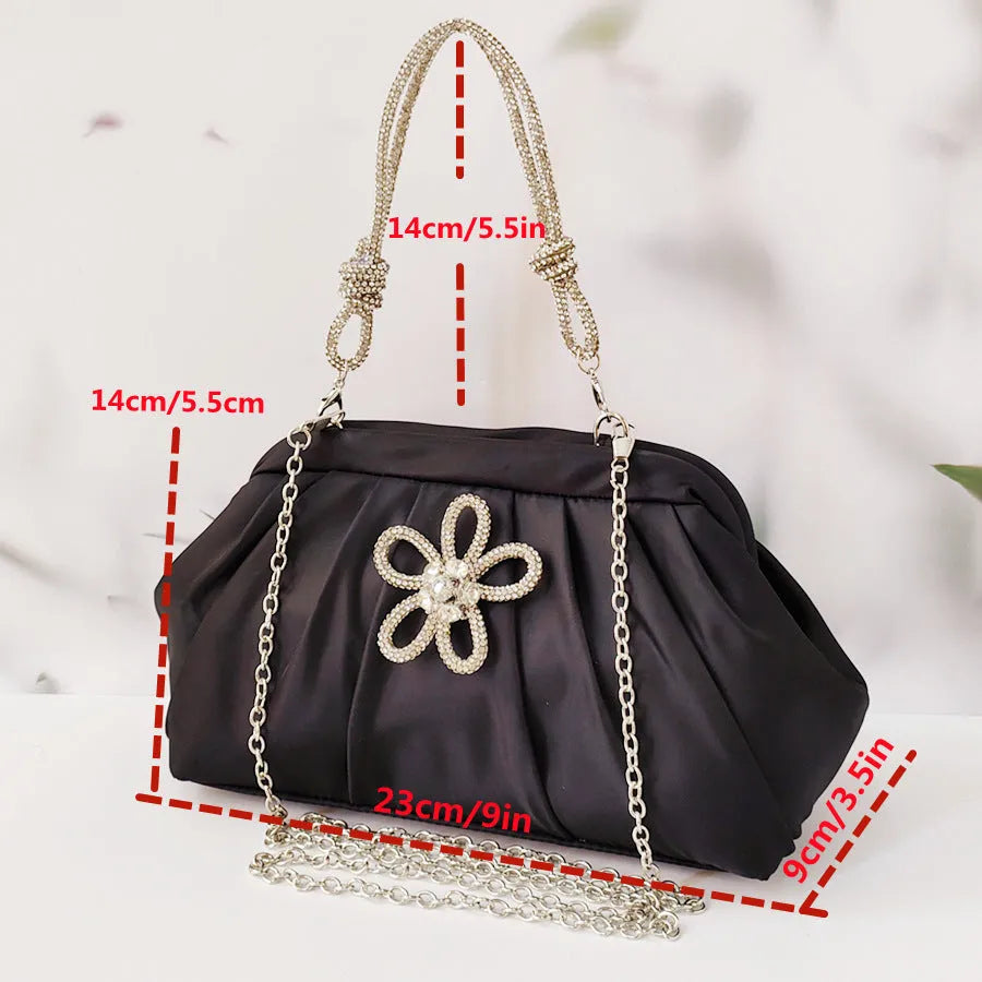 Women's soft polyester messenger bag with diamond folds and chain detailing in black colour