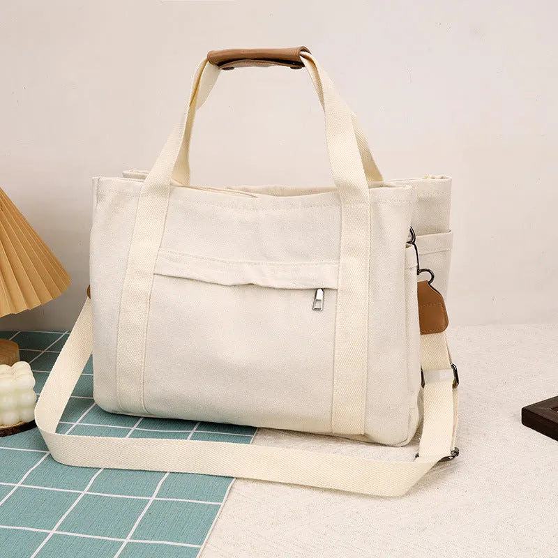 Large capacity canvas tote bag with internal organisation pockets and open on both sides zipper closure