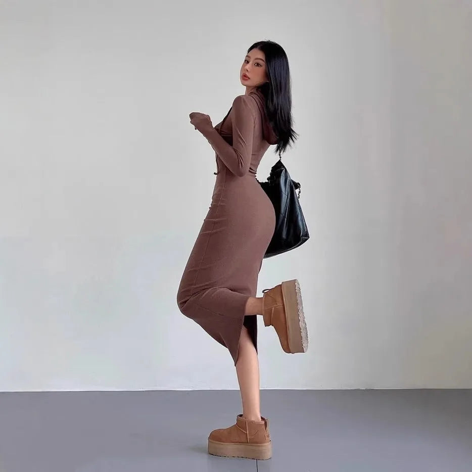 Women's grey hooded long sleeve sheath dress with a high waist on a hanger.