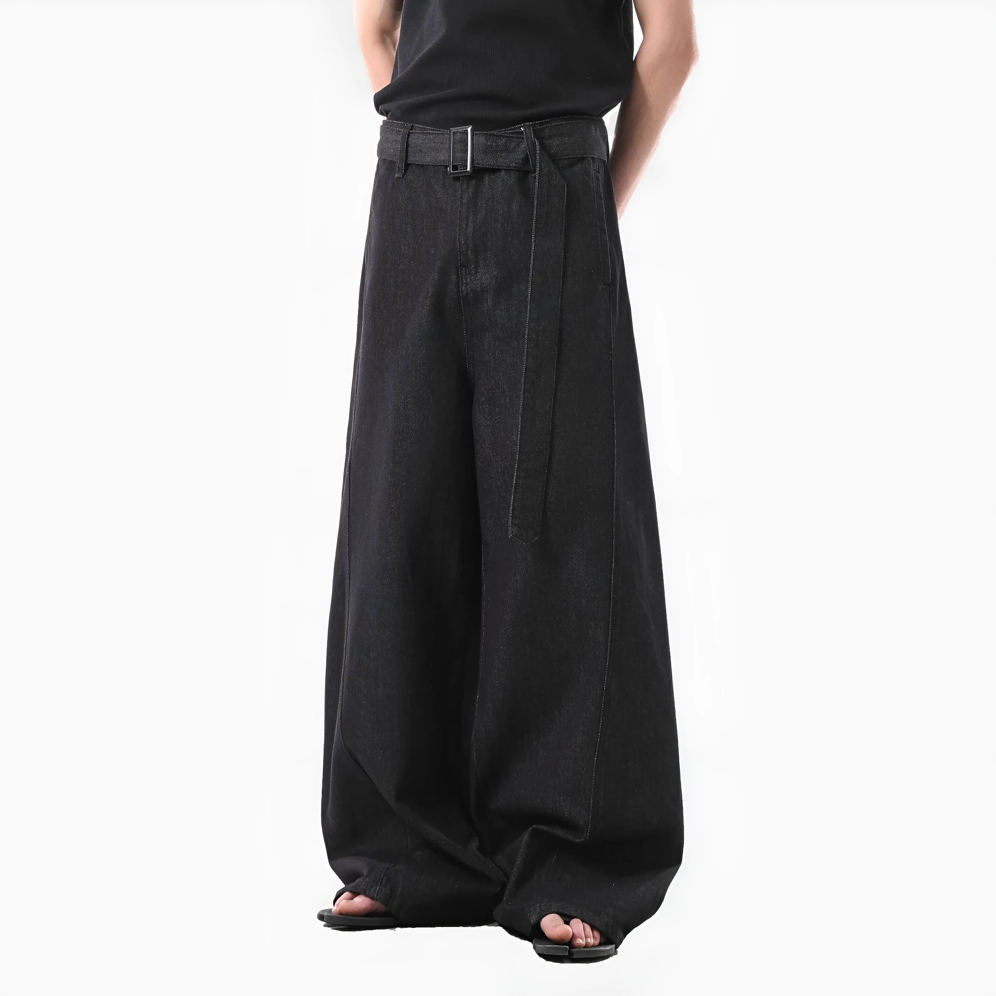 Black straight leg jeans with high waist and subtle gold metallic details, zip fly fastening