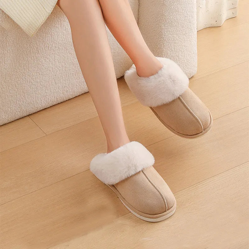 Women's plush-lined indoor slippers with round toe and flat heel in a choice of colours.