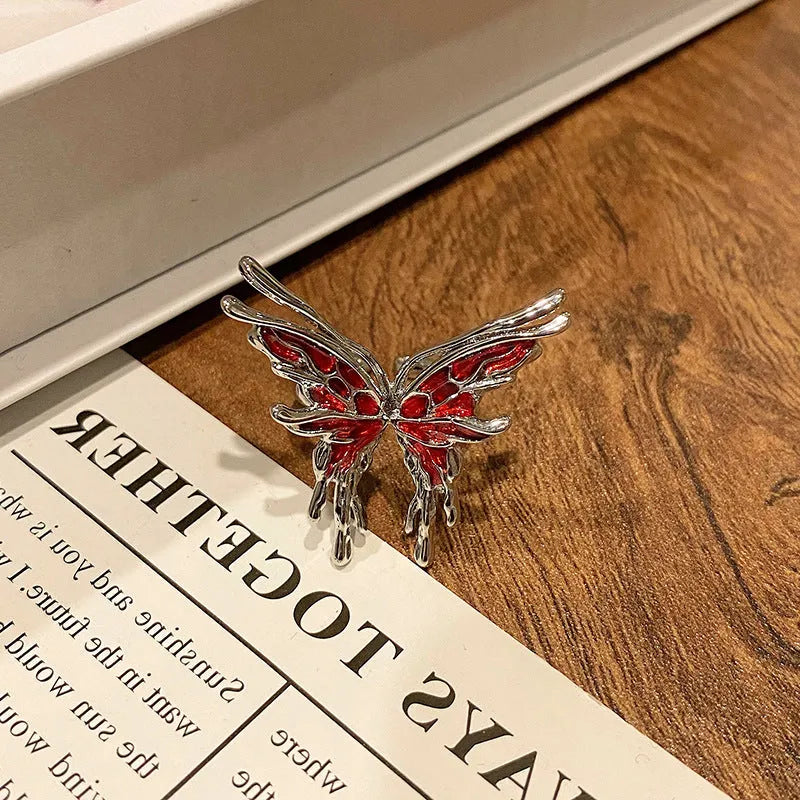 Copper butterfly women's ring with drip oil finish in an open-loop design.