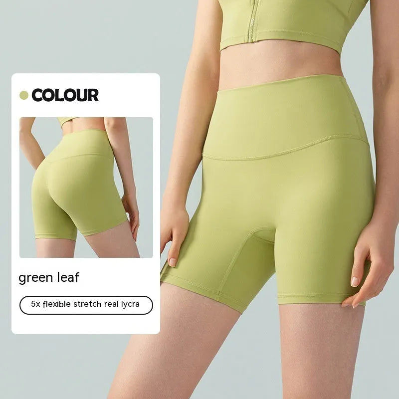 Women's high elastic yoga shorts in leaf green colour with high waist and anti-exposure design for summer workouts