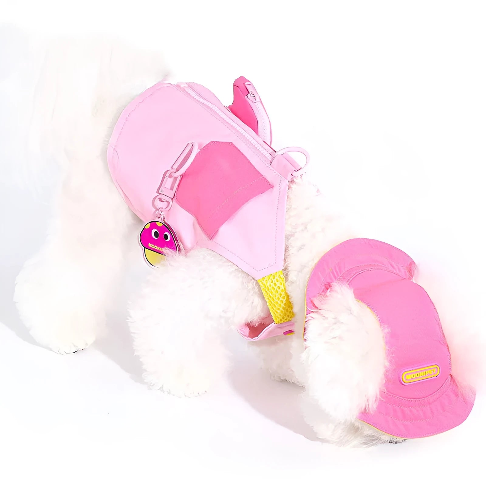 Pink polyester traction vest for a small white dog on a grey background.