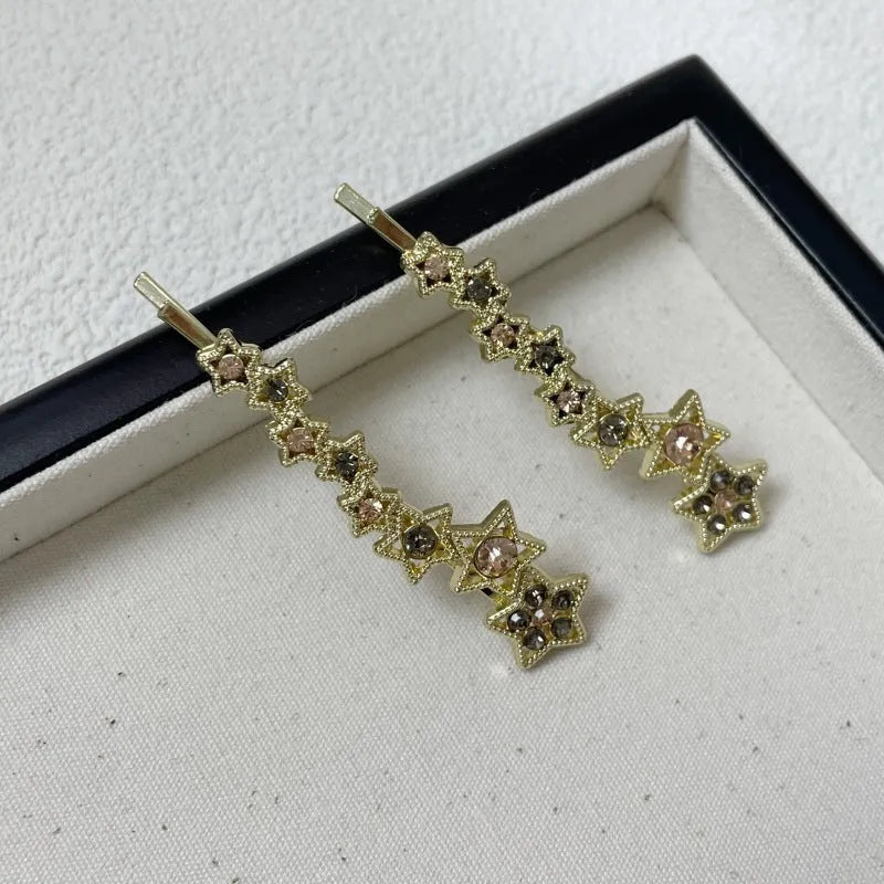 Gold electroplated rhinestone barrette with star design hair clip