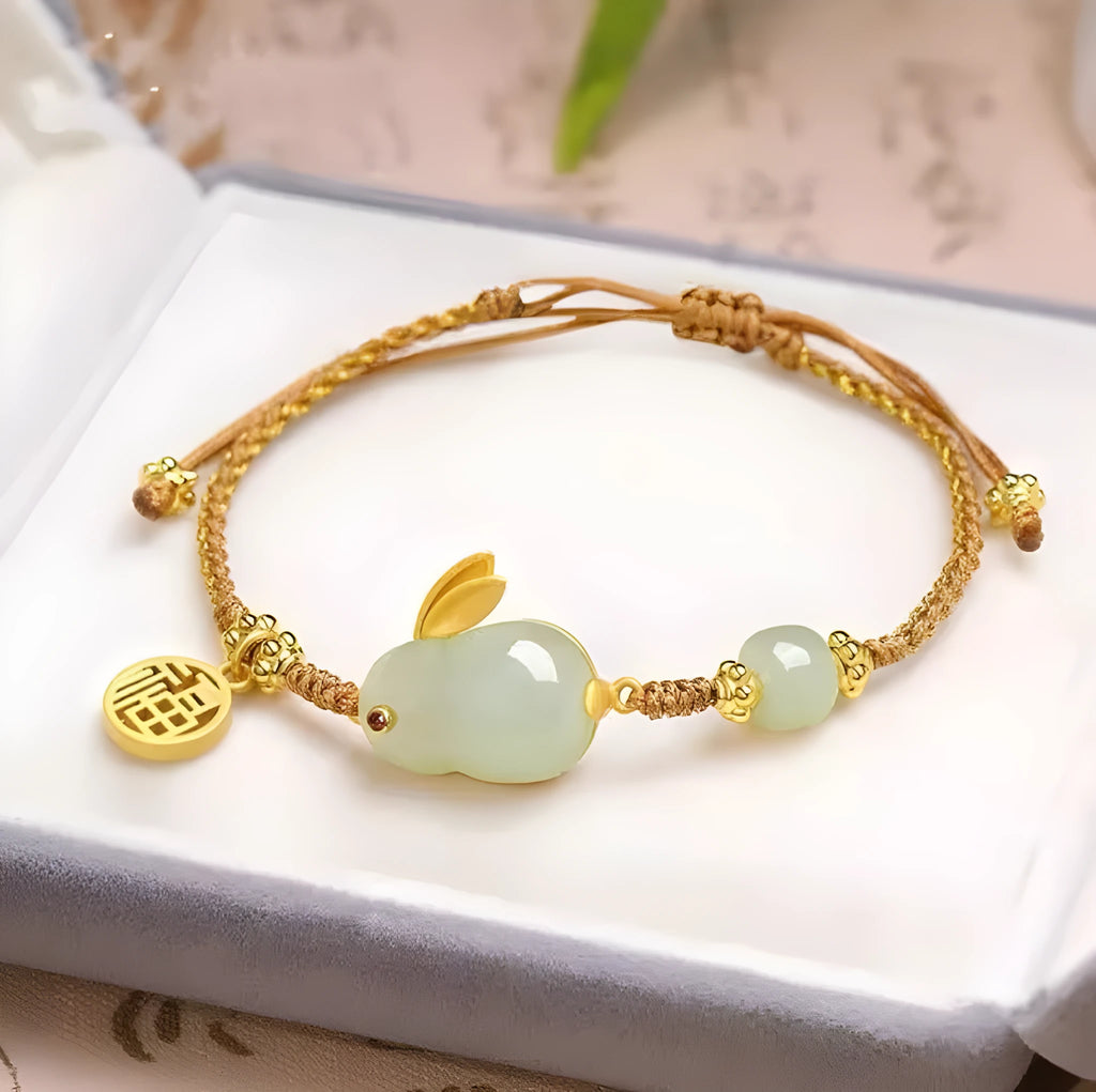 Yellow string bracelet with a geometric Hetian jade rabbit charm for women.