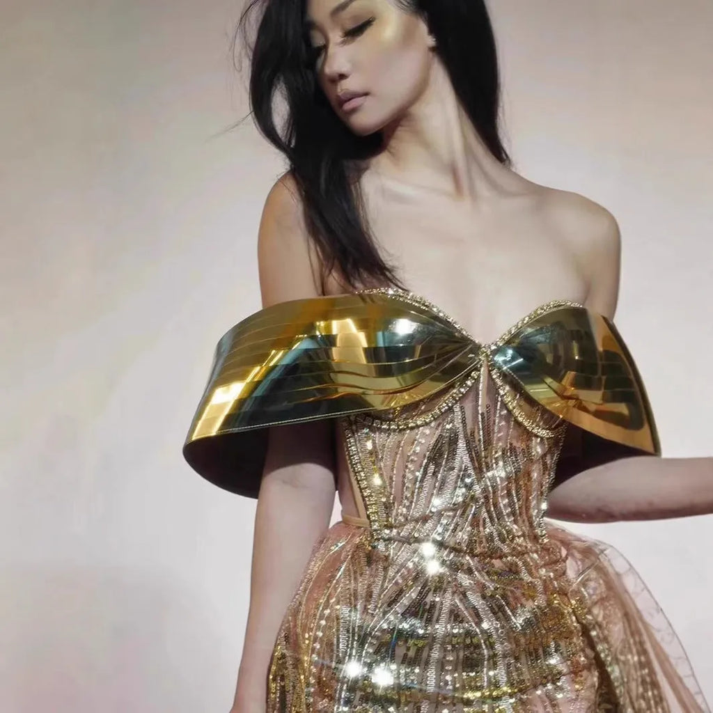 Gold strapless sequined evening dress with high split skirt and full sequin coverage