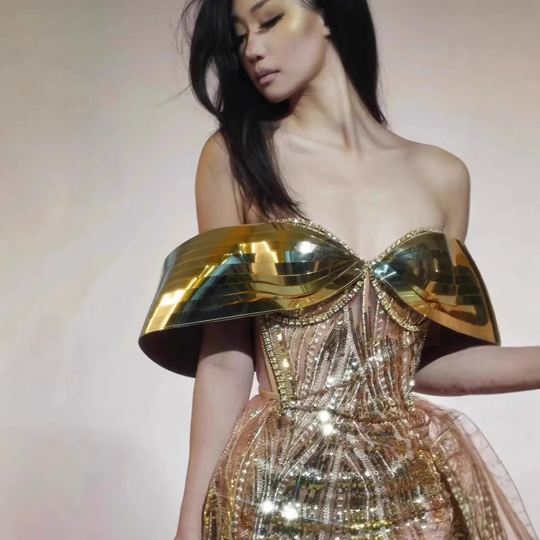 Gold strapless sequined evening dress with high split skirt and full sequin coverage