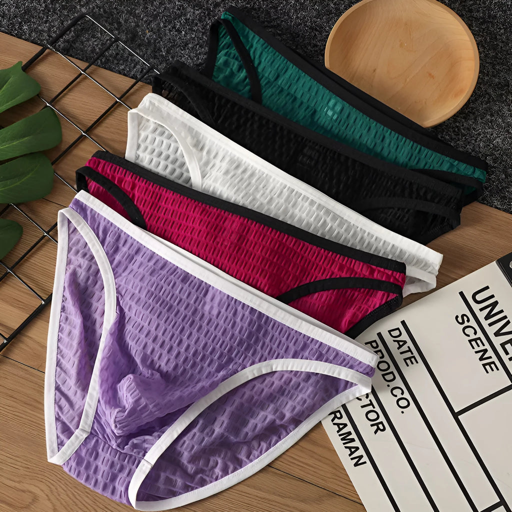 Men's low waist lace underwear in black on a white background