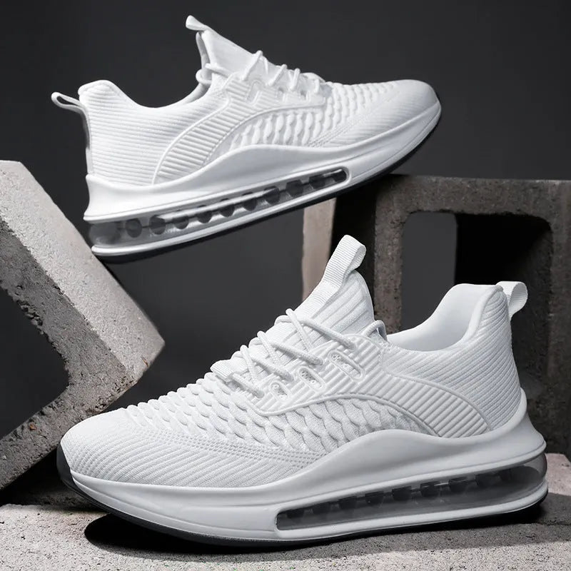Men's low-top black mesh running sneakers with rubber sole and lace-up front, shown on a white background.