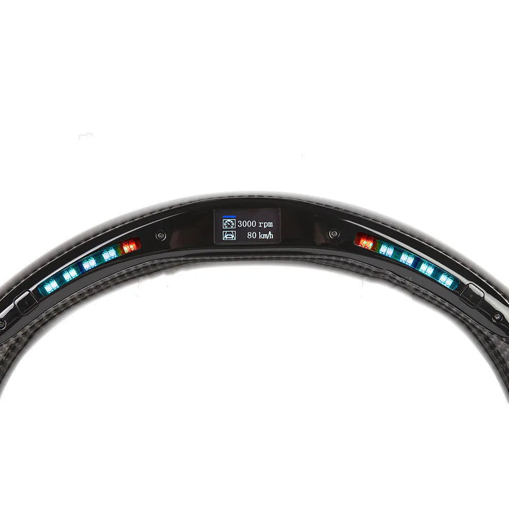 Black carbon fibre steering wheel for BMW with integrated LED display and heating function.