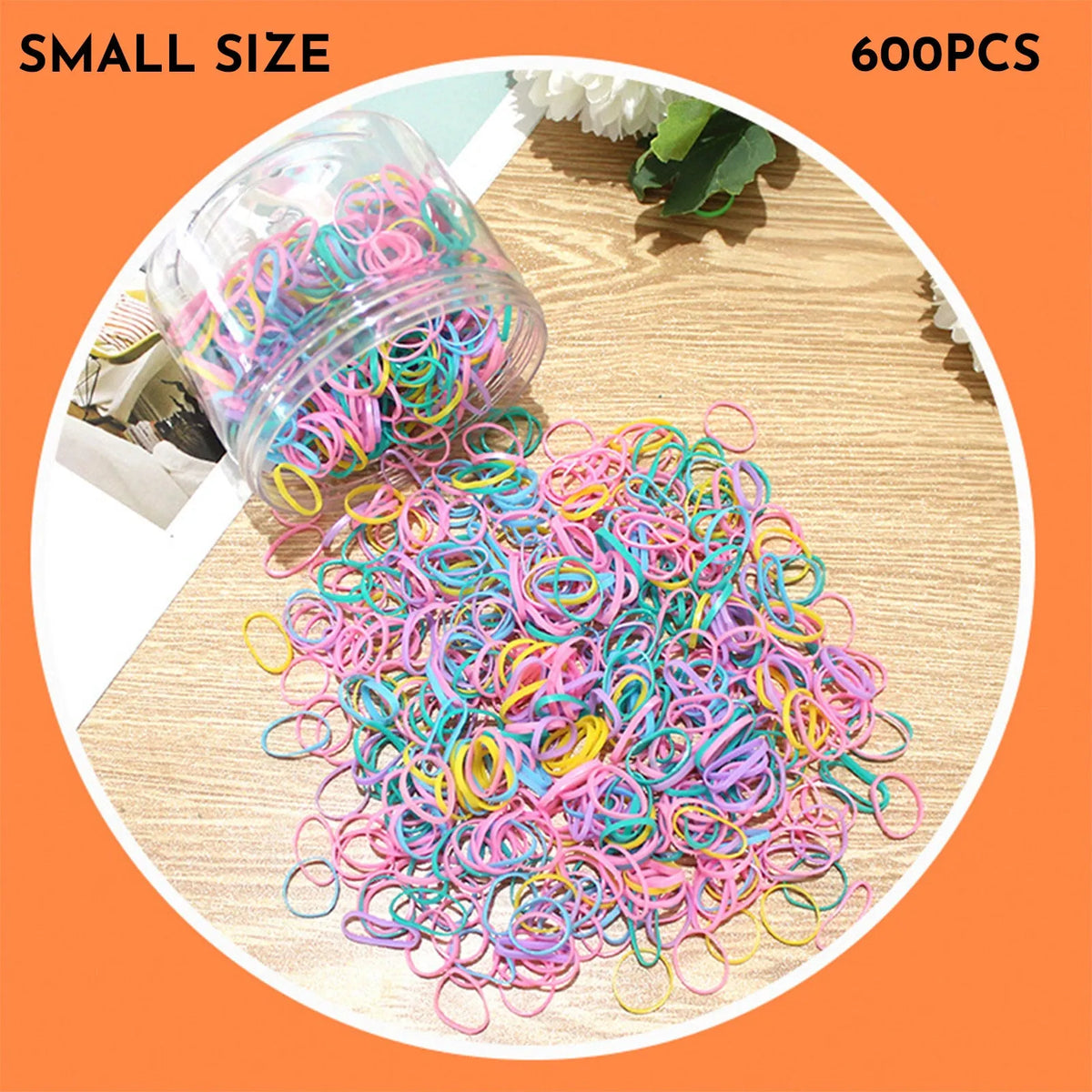 Pack of small, colourful TPU elastic hair bands for babies and toddlers in a reusable container.
