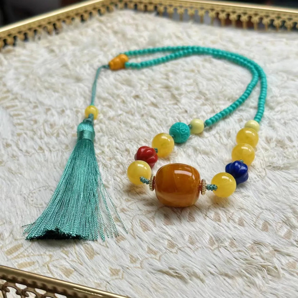 Turquoise mesh flower lucky pendant on ball bead chain necklace, hand-woven construction