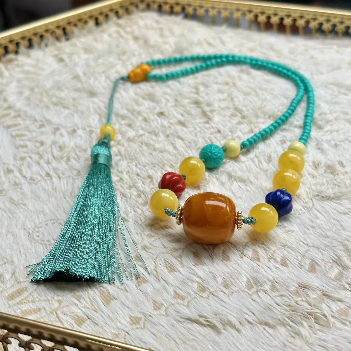 Turquoise mesh flower lucky pendant on ball bead chain necklace, hand-woven construction