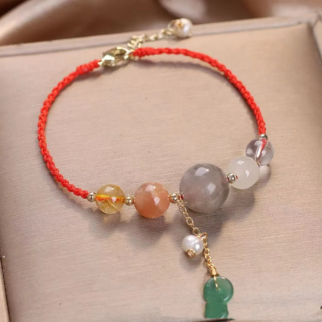 Hand-woven crystal sequin bracelet with peace buckle closure in blue, green and red colour options