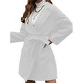 Brown loose-fit long coat with lapel, buttons, belt, and split hem on a model.